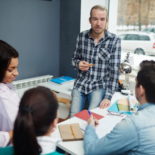 Confident expert voicing his ideas or some working points to colleagues